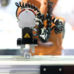 30c99183-b3a7-48b9-9d0c-8c8d6f10fc15 Automatic robot arm with imaging sensor in assembly line working in factory. Smart factory industry 4.0 concept.